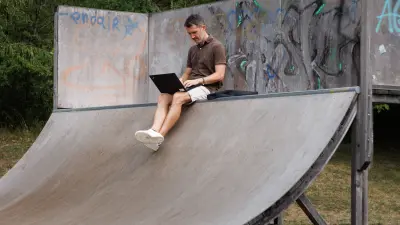 Bosch associate Kajetan Fritz with notebook on a skater ramp