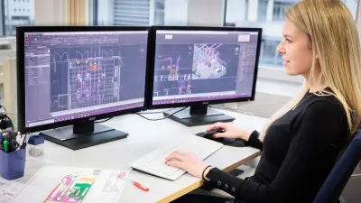 Bosch associate Sabrina Ruis doing planning work on two monitors.