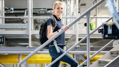 Sabrina Ruis on the stairs in the energy supply center at the Bosch Power Tools headquarters in Leinfelden-Echterdingen 
