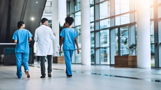 nurses and doctors walking in hospial