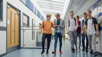 Kids in school hall protected by an emergency and hazard response systems from Climatec and Bosch