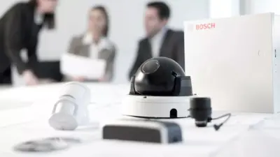 Video monitoring and analysis systems from Bosch Building Technologies lying on a desk