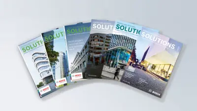 Picture with SOLUTIONS magazines of the last couple of years