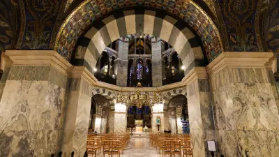 Seated interior of Aachen Cathedral with view of the altar pendium