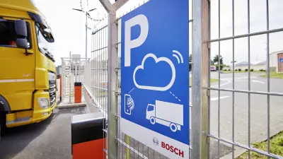 Security parking sign at Autohof Frechen gate entry.
