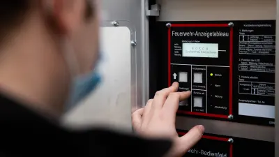 Service technician Kevin Wilhelm at a fire department display board