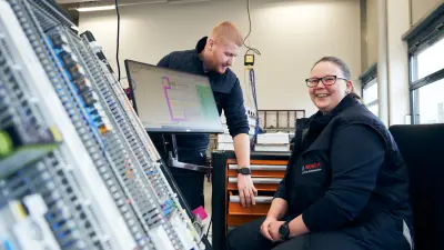 Bosch Building Automation employees digitally testing control cabinet elements