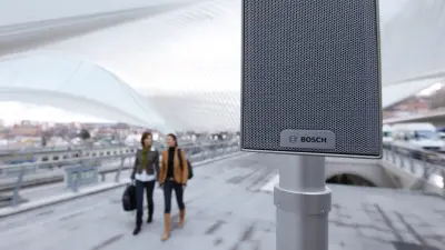 Public Address stage image two women walking and chatting