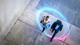 Two individuals recorded by a security camera are pixelated through privacy masking.